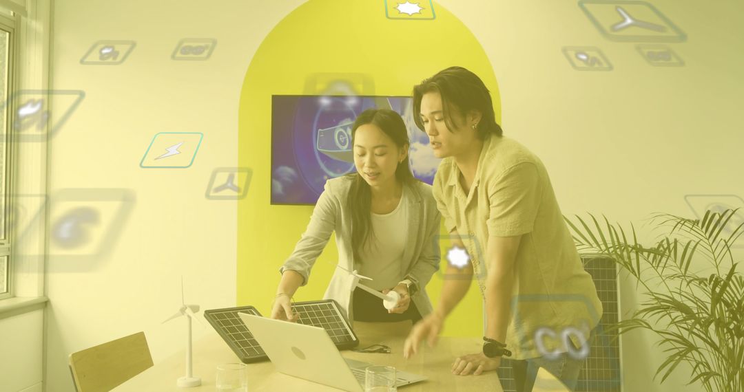 Engineers Collaborating on Renewable Energy Technology in Office