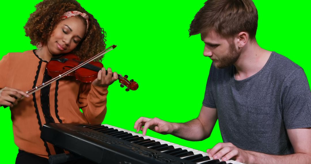 Two Musicians Jamming Together with Violin and Keyboard - Free Images, Stock Photos and Pictures on Pikwizard.com