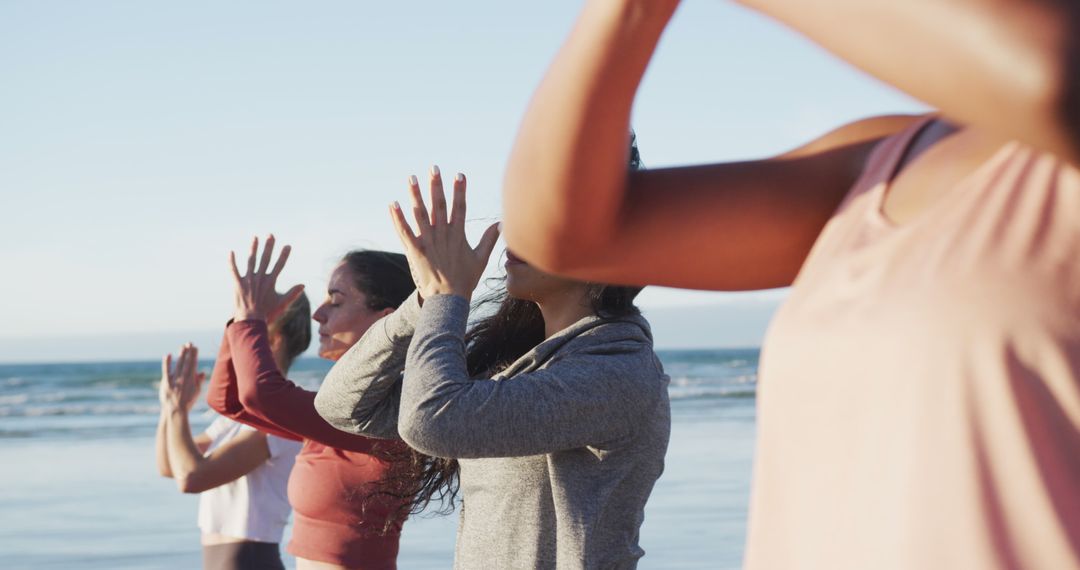 Group of Women Doing Yoga on Beach at Sunrise - Free Images, Stock Photos and Pictures on Pikwizard.com