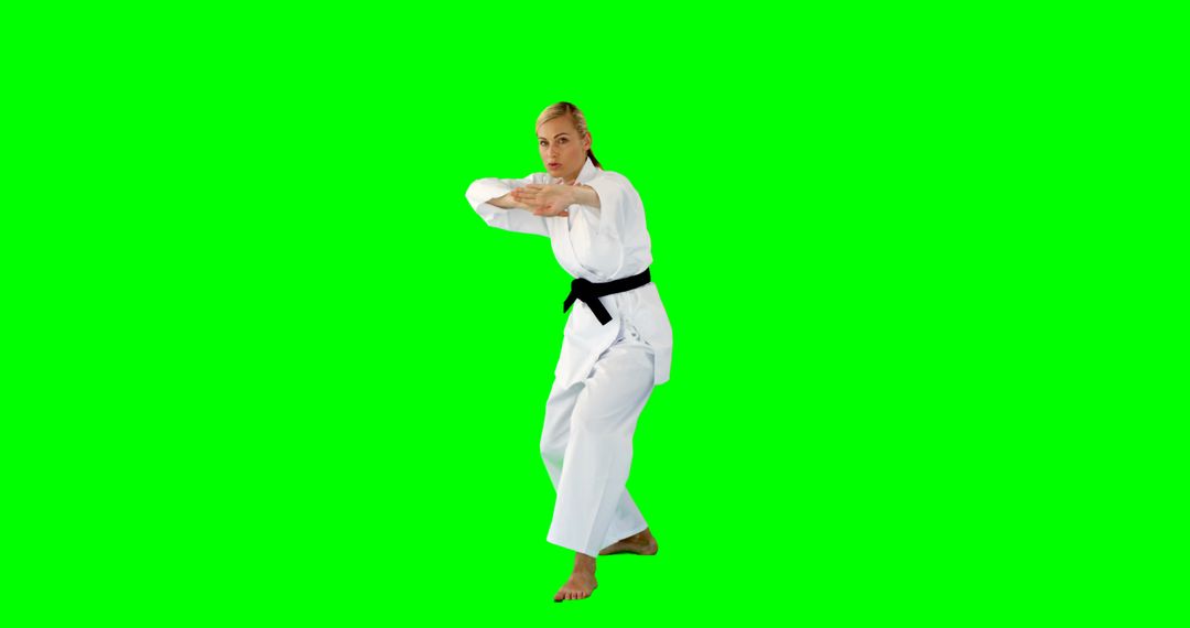 Woman Practicing Martial Arts in Traditional Uniform on Green Screen - Free Images, Stock Photos and Pictures on Pikwizard.com