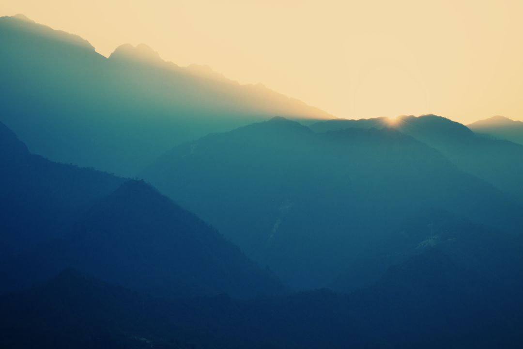 Mystical Sunrise Over Mountain Range - Free Images, Stock Photos and Pictures on Pikwizard.com