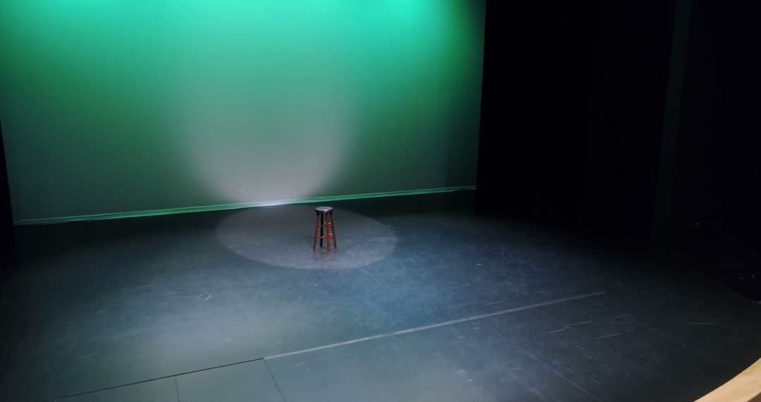 Empty stage with single spotlight on stool - Free Images, Stock Photos and Pictures on Pikwizard.com