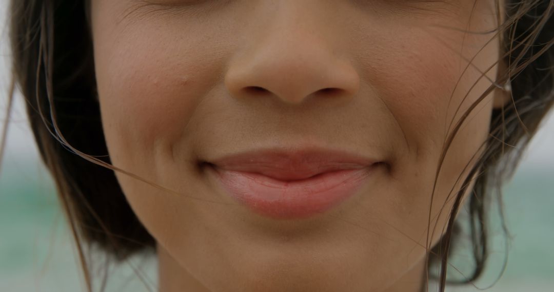 Smiling Woman Enjoying Beach Breeze Close-Up