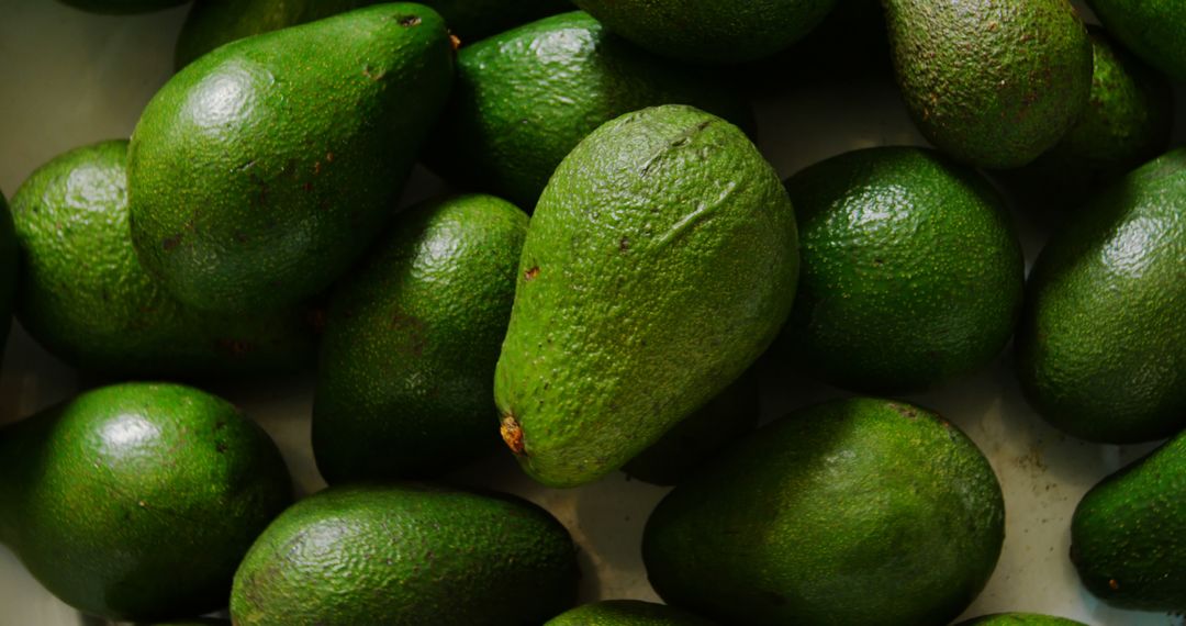 Close-Up of Fresh Green Avocados in Market Basket - Free Images, Stock Photos and Pictures on Pikwizard.com