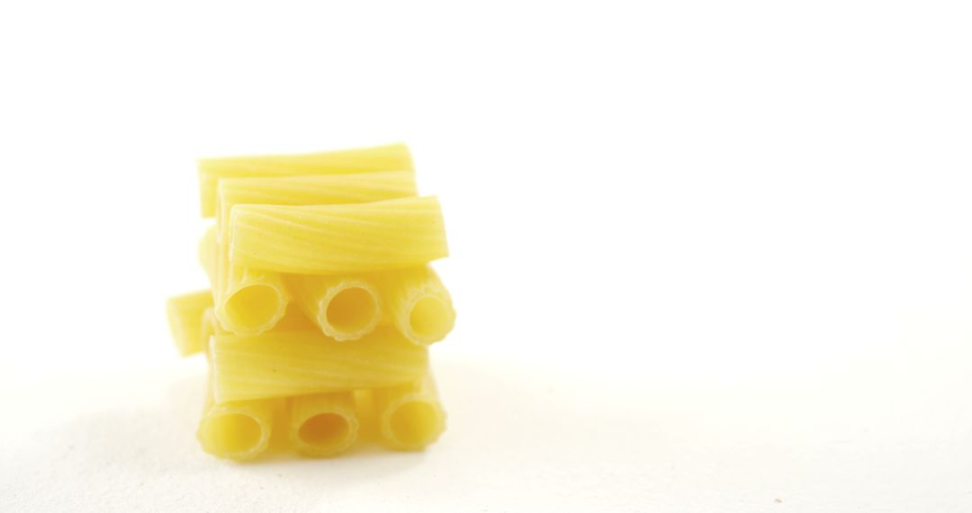 Close-Up of Uncooked Rigatoni Pasta on White Background - Free Images, Stock Photos and Pictures on Pikwizard.com