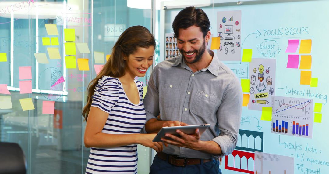 Two Business Executives Engaging in Tablet Presentation