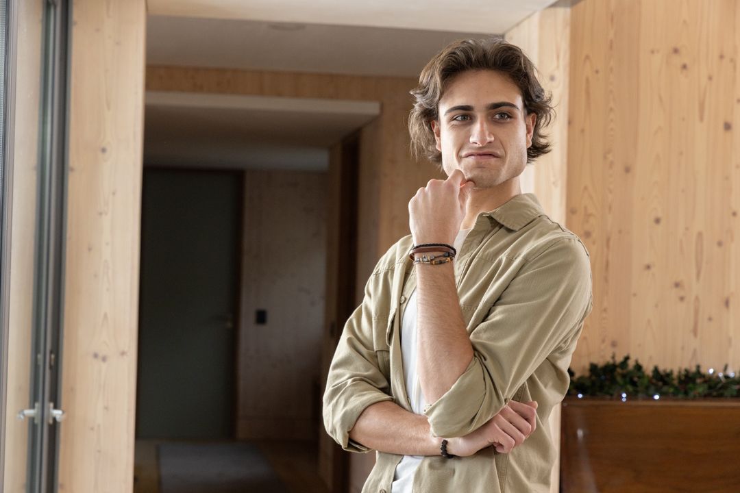 Contemplative Man Refreshing Mind in Minimalist Scandinavian Interior