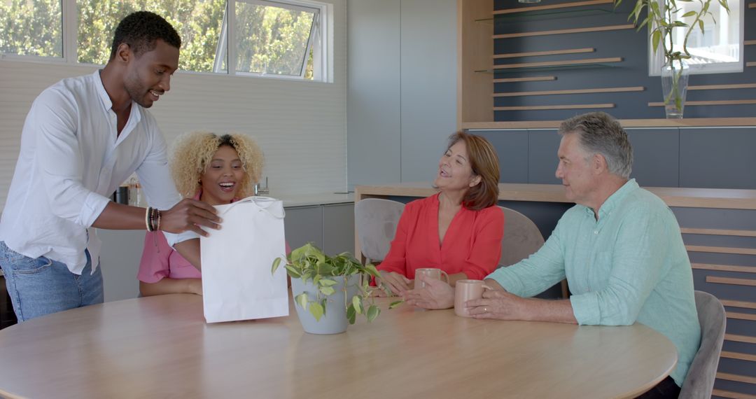 Diverse Family Gathering Around Table with Laughter and Smiles