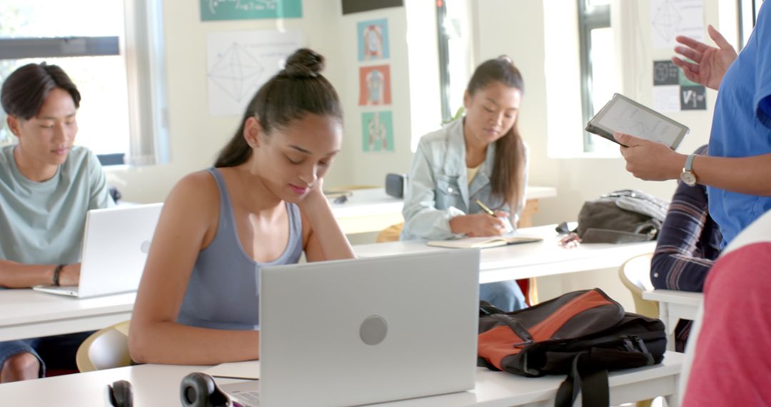 High School Students Focused on Digital Learning with Laptops