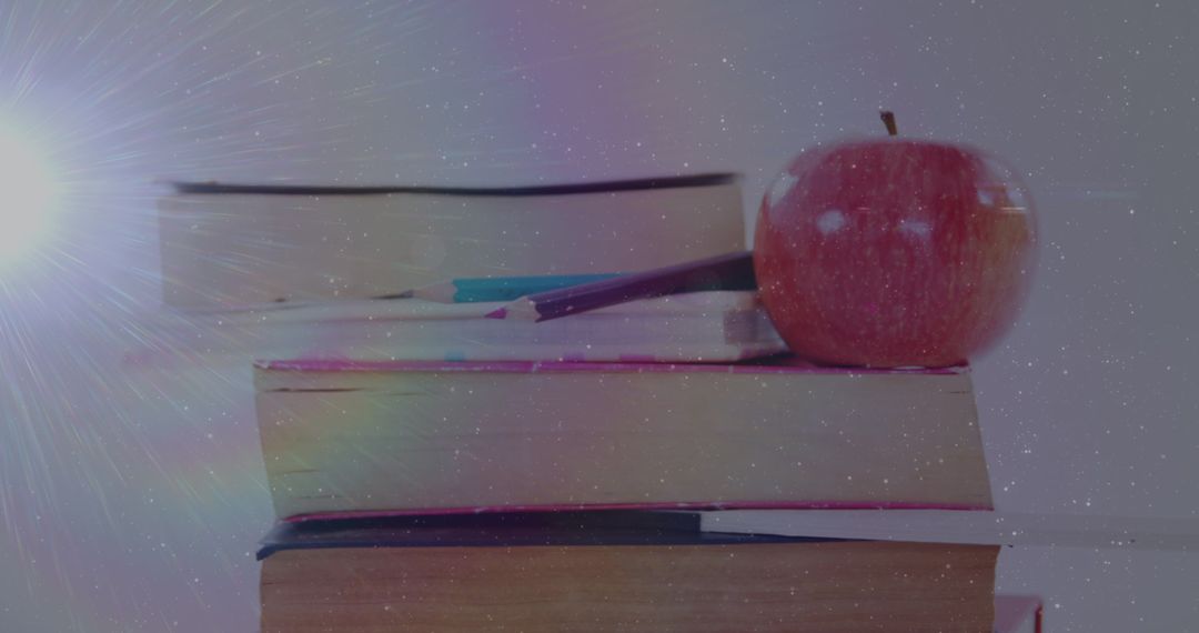 Books and Apple with Bright Light Effect Celebration Theme