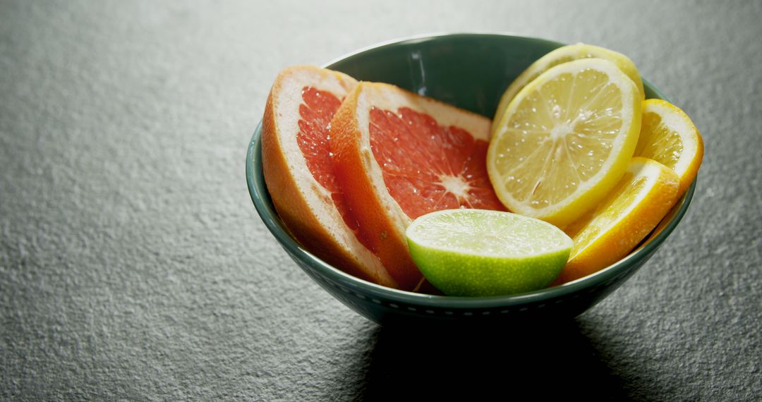 A bowl of colorful citrus slices offers a visually appealing healthy snack. - Free Images, Stock Photos and Pictures on Pikwizard.com