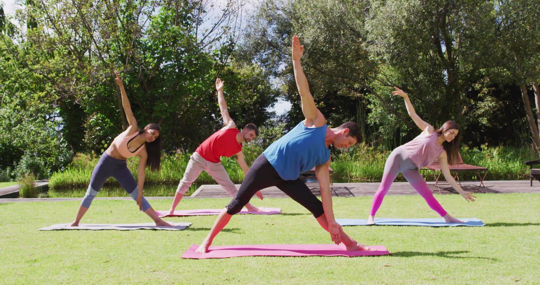 Outdoor Yoga Class with Diverse Group Stretching in Park