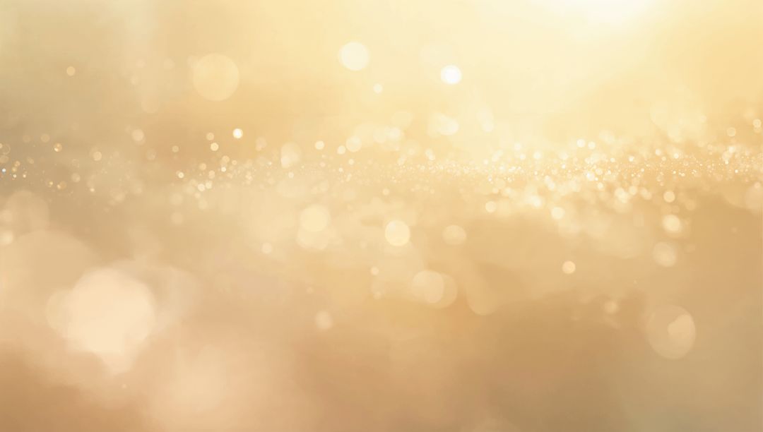 Golden glitter bokeh background with shimmering dust, warm glow and sparkling highlights