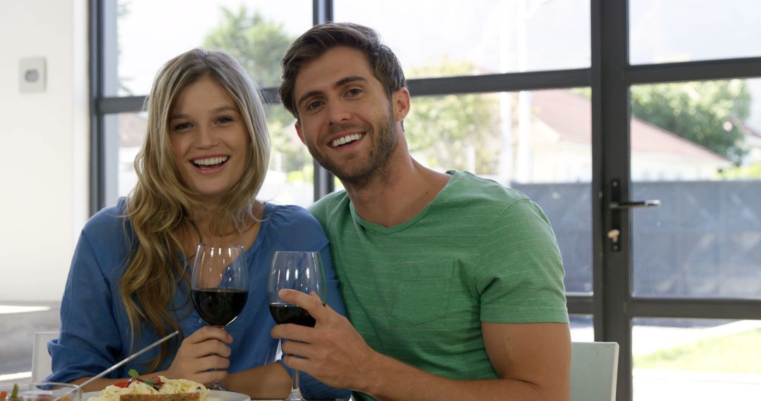 Smiling Couple Enjoying Dinner with Wine at Home - Free Images, Stock Photos and Pictures on Pikwizard.com