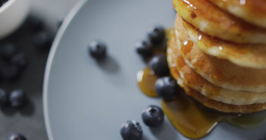 Stack of Pancakes with Syrup and Blueberries