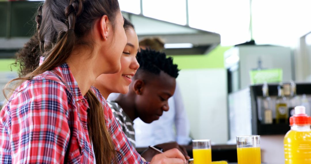 Collaborative Students Studying Together in Cafeteria