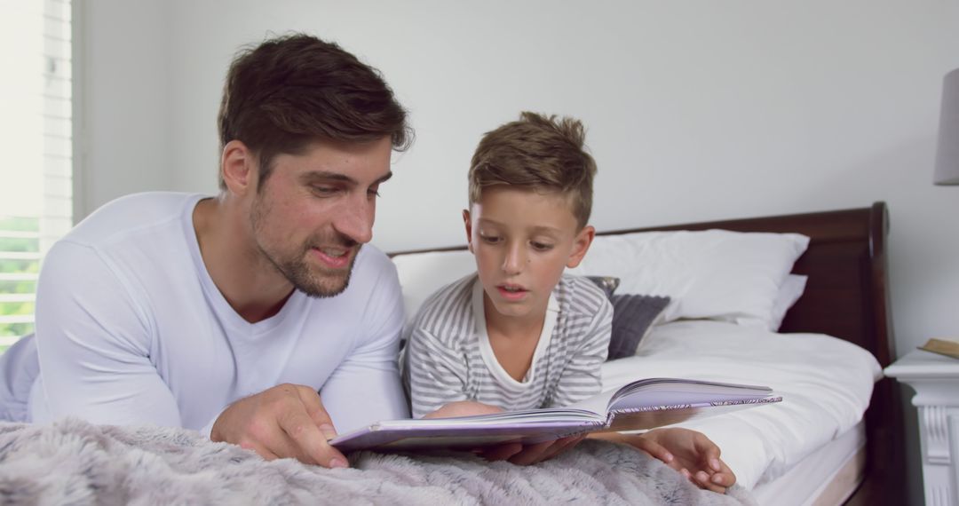 Father Reading Bedtime Story to Son in Cozy Bedroom - Free Images, Stock Photos and Pictures on Pikwizard.com