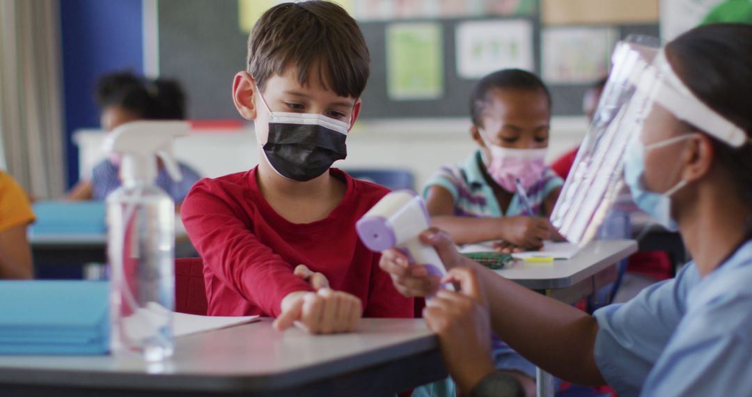 Healthcare Worker Screening Child in Classroom During Pandemic - Free Images, Stock Photos and Pictures on Pikwizard.com