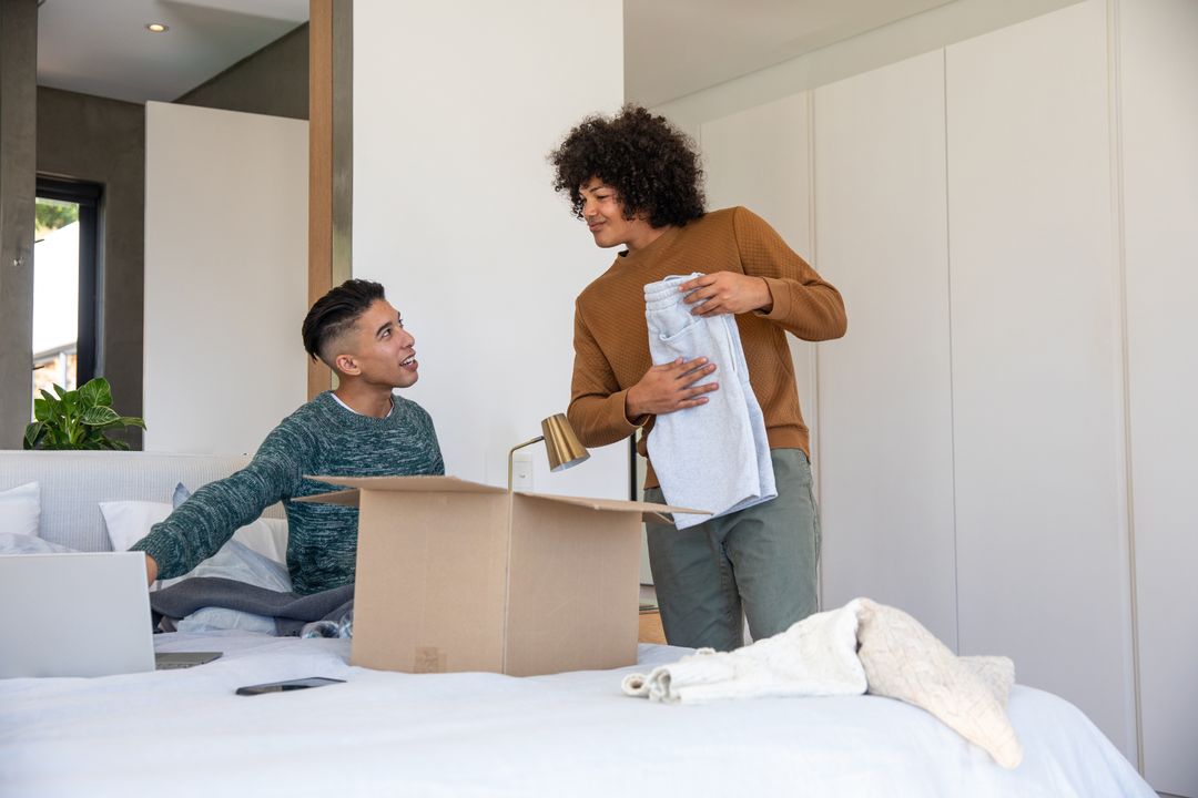 Friends Enjoying Time Unpacking After Move at Home