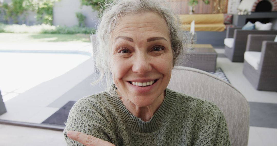 Smiling Senior Woman Relaxing Outdoors in Garden - Free Images, Stock Photos and Pictures on Pikwizard.com