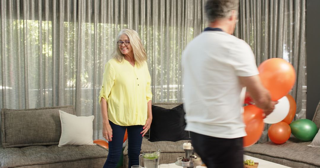 Colleagues Preparing for Office Party with Balloons