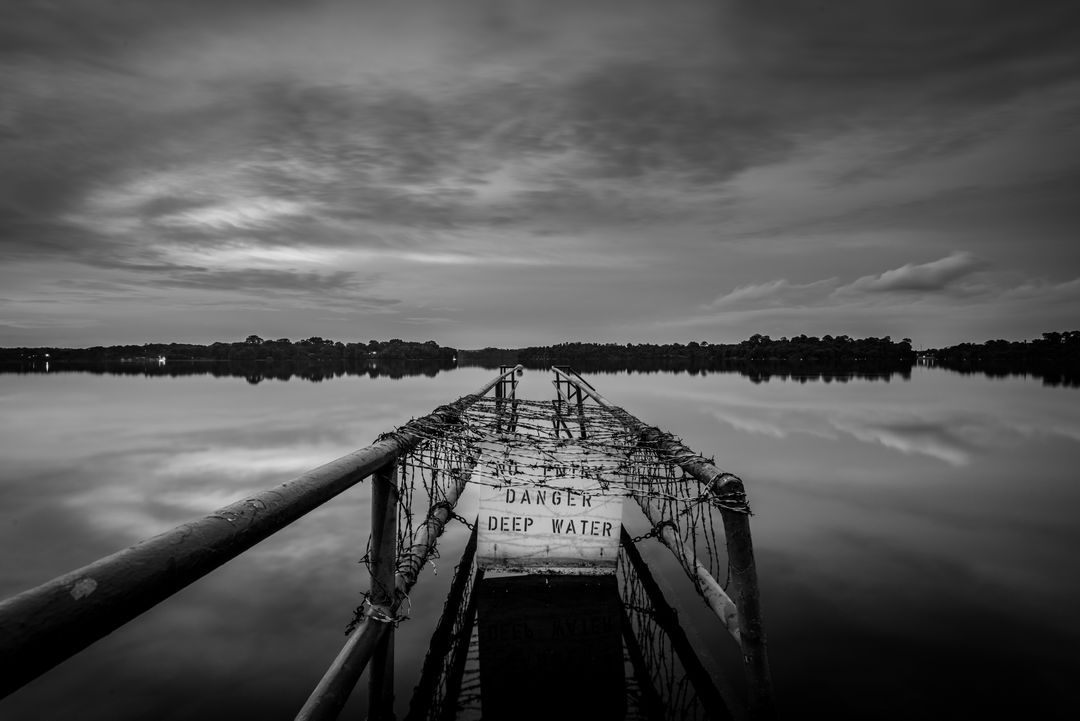 Abandoned Dock Over Still Water in Black and White - Free Images, Stock Photos and Pictures on Pikwizard.com