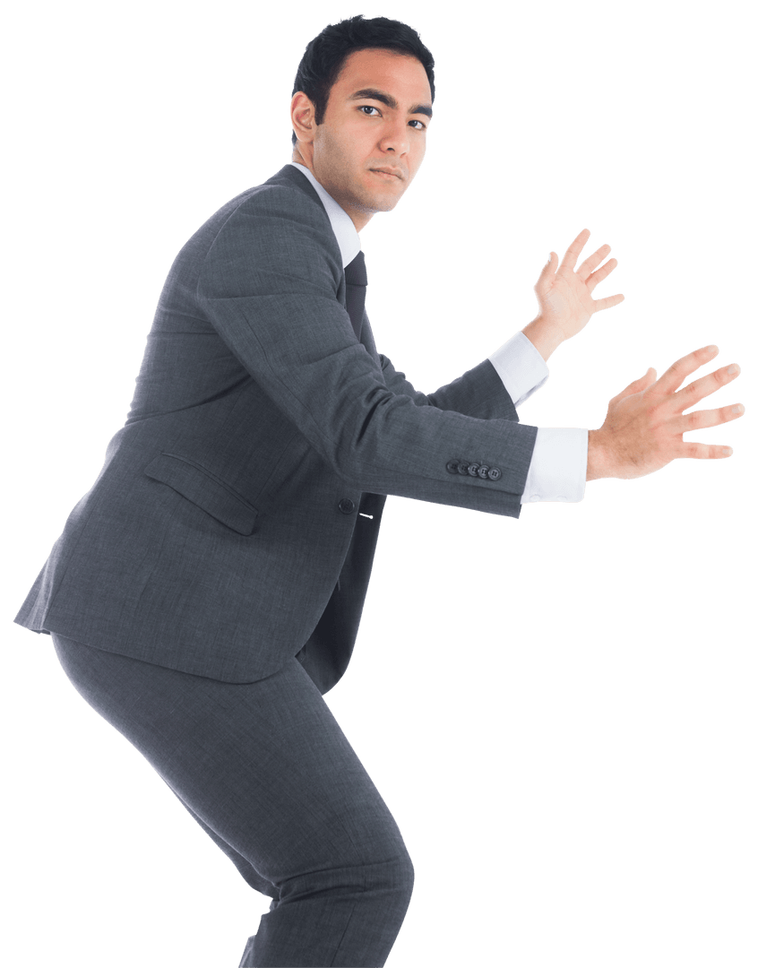 Serious Businessman in Suit Holding Invisible Object on Transparent Background