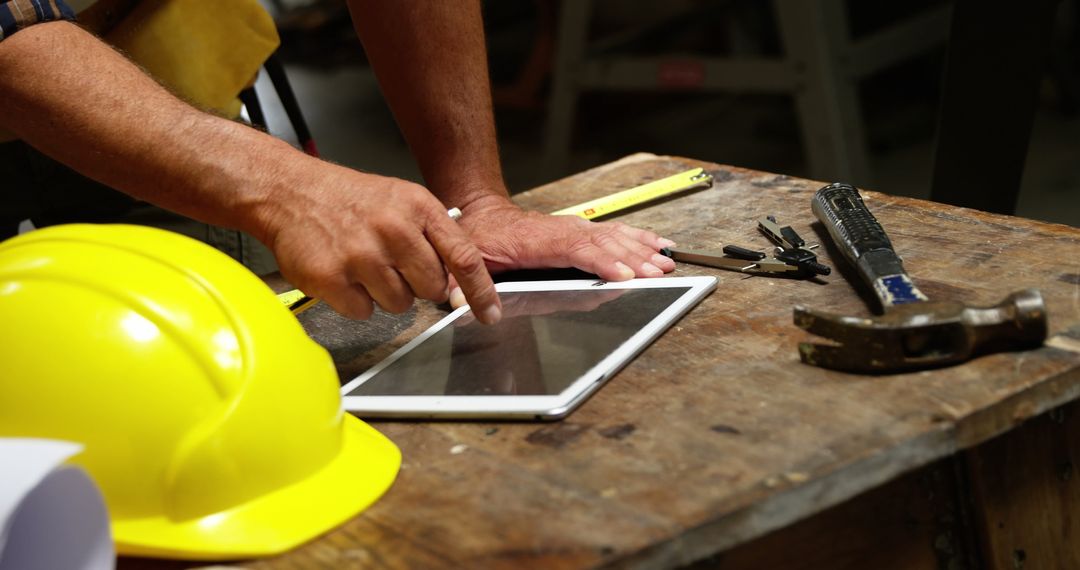 Carpenter Using Tablet in Workshop for Planning - Free Images, Stock Photos and Pictures on Pikwizard.com