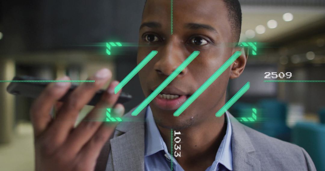 African American Businessman Using Smartphone in High-Tech Office