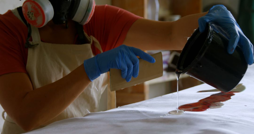 Person Pouring Epoxy Resin on Wooden Surface with Protective Gear - Free Images, Stock Photos and Pictures on Pikwizard.com