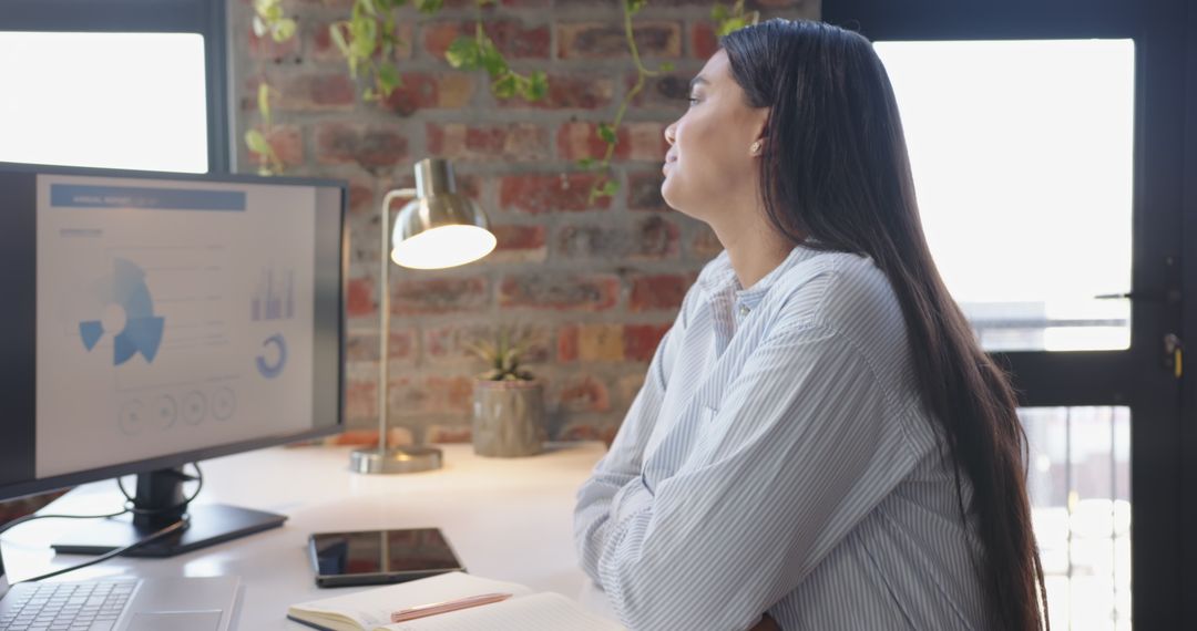 Contemporary Office Environment with Chart Analysis and Technology