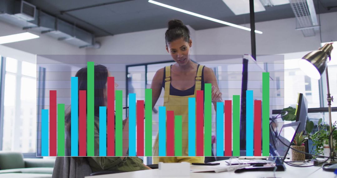 Diverse Female Colleagues Analyzing Data with Digital Interface Overlay