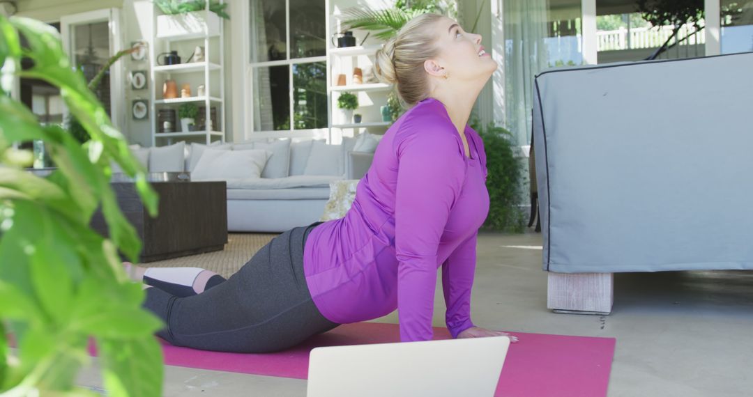 Woman Practicing Yoga At Home Using Laptop - Free Images, Stock Photos and Pictures on Pikwizard.com