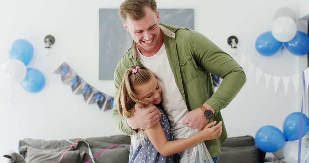 Father and Daughter Smiling While Cleaning After a Party