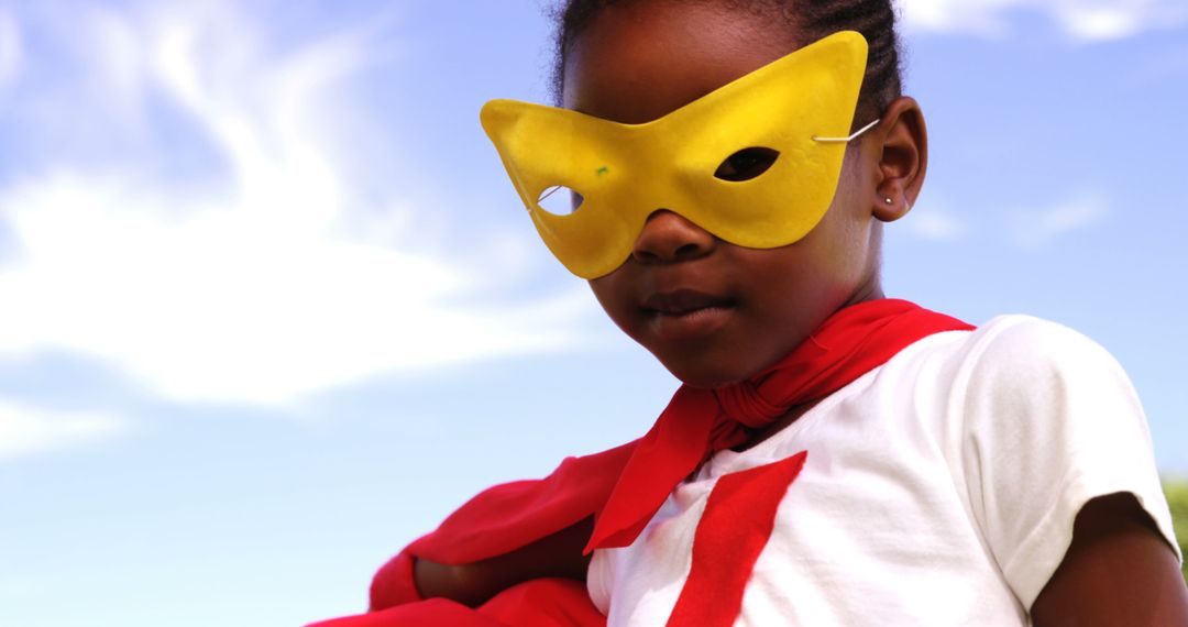 Young Hero in Yellow Mask and Red Cape Posing Outdoors - Free Images, Stock Photos and Pictures on Pikwizard.com