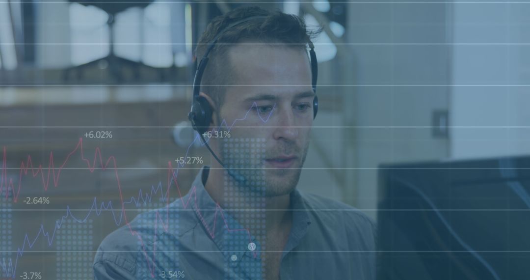 Businessman Analyzing Financial Data on Monitor