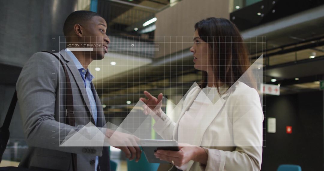Diverse Colleagues Discussing with Data Interface Overlay in Modern Office