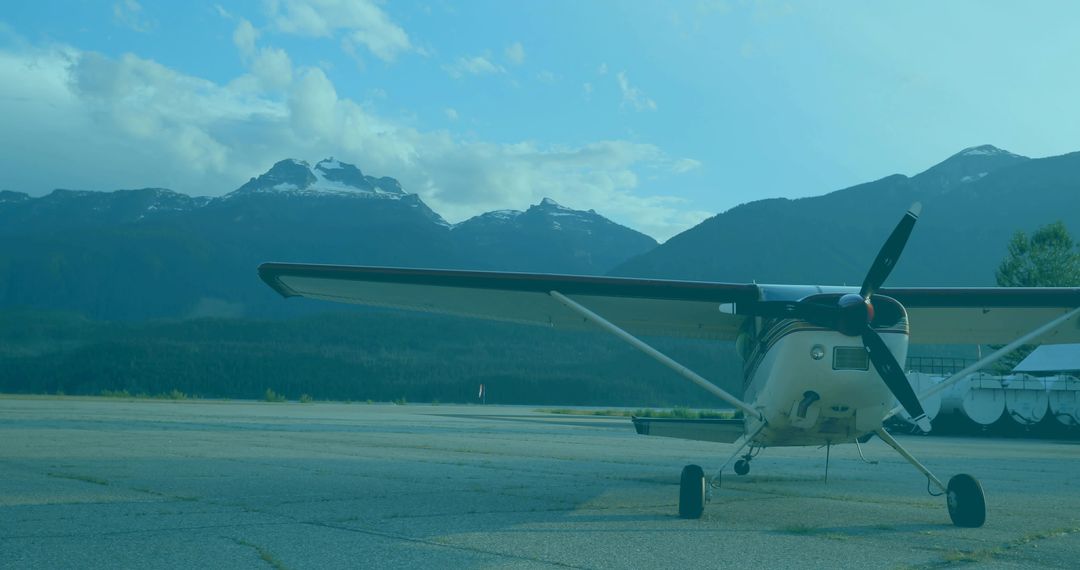 Single-Engine Propeller Airplane on Mountain Runway