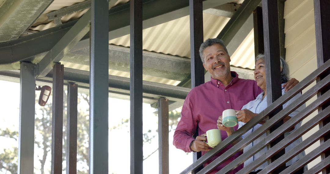 Happy Senior Couple Drinking Coffee on Balcony - Free Images, Stock Photos and Pictures on Pikwizard.com