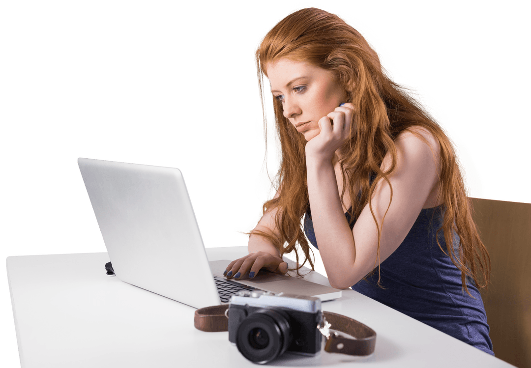 Redhead Woman Concentrating on Transparent Laptop
