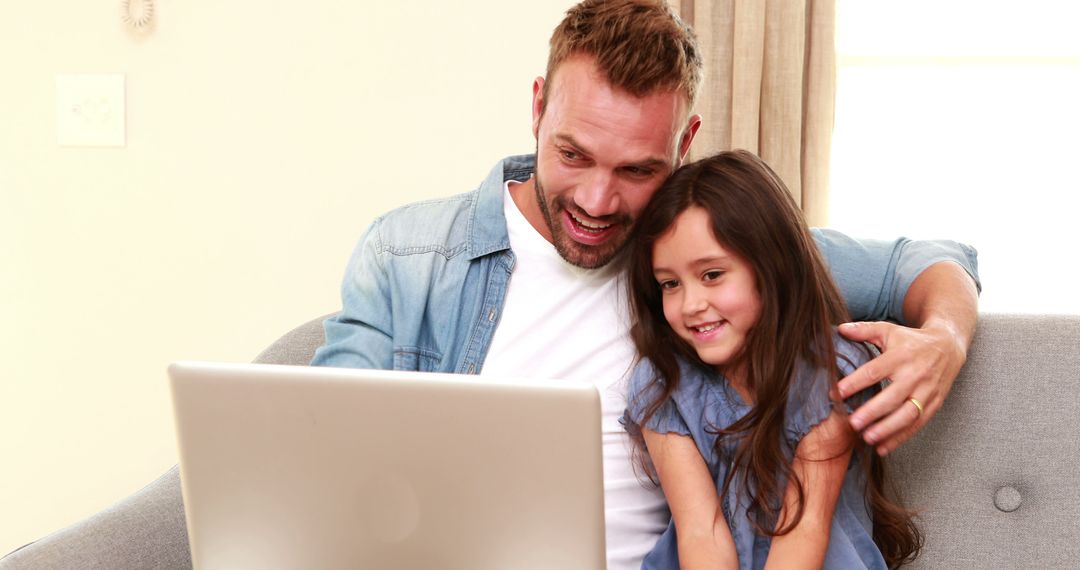 Father and Daughter Smiling While Using Laptop at Home - Free Images, Stock Photos and Pictures on Pikwizard.com