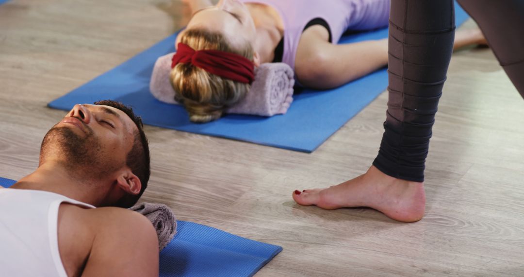 Group Practicing Relaxation Techniques in Yoga Class