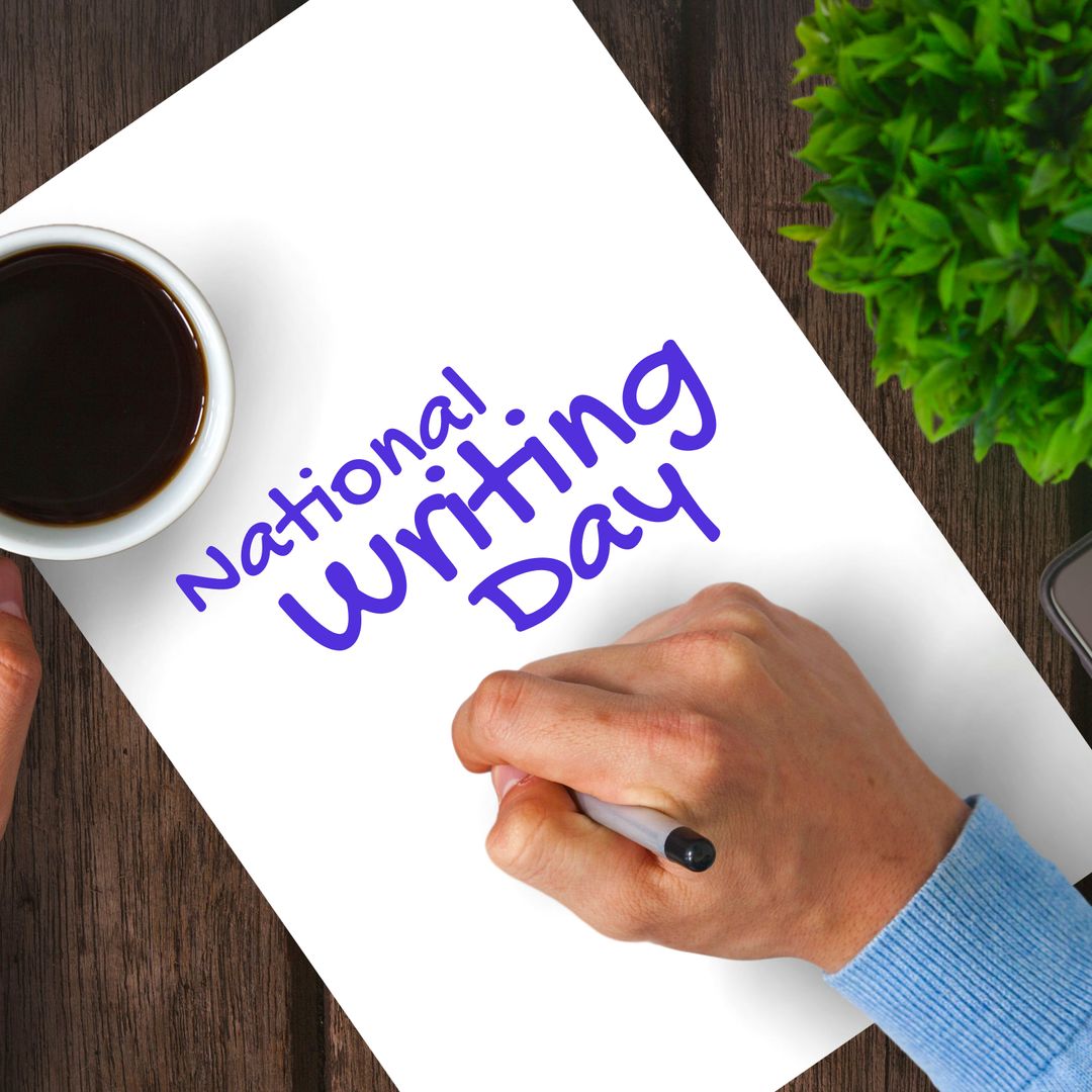 Top View of Hands Writing National Writing Day Note with Coffee