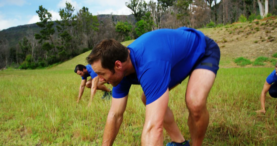 Men Participating in Outdoor Training Exercises in Field - Free Images, Stock Photos and Pictures on Pikwizard.com