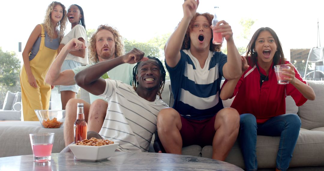 Diverse Group of Friends Excitedly Watching Sports Game on TV - Free Images, Stock Photos and Pictures on Pikwizard.com