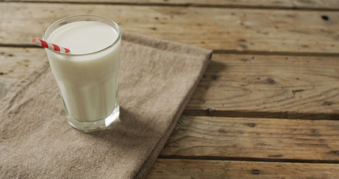 Image of glass of fresh milk on wooden background - Free Images, Stock Photos and Pictures on Pikwizard.com