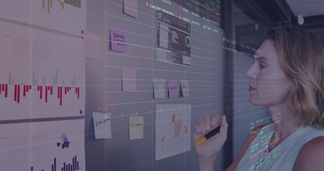Businesswoman Analyzing Digital Interface with Data Visualizations