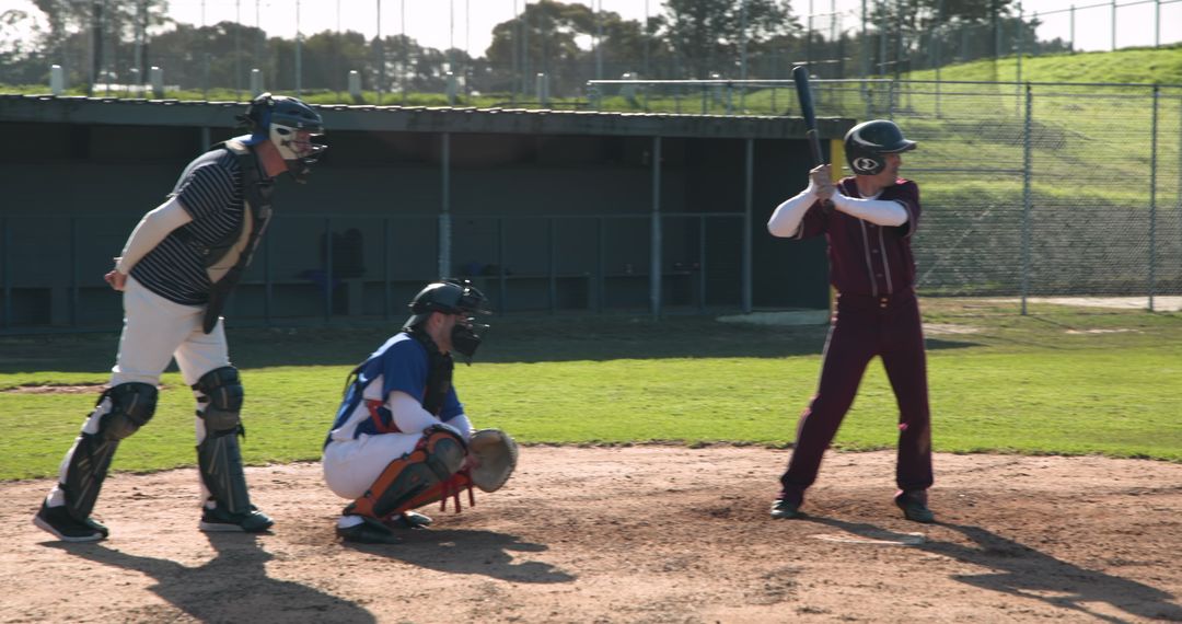 Baseball Players in Action: Batter, Catcher and Umpire in Game