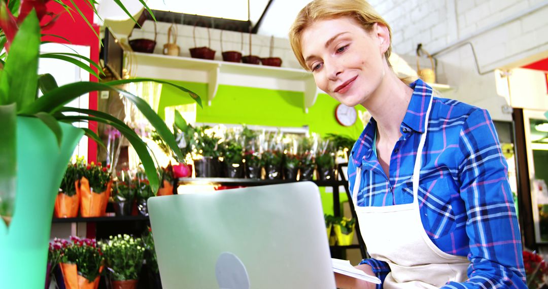 Flower Shop Owner Managing Business on Laptop - Free Images, Stock Photos and Pictures on Pikwizard.com