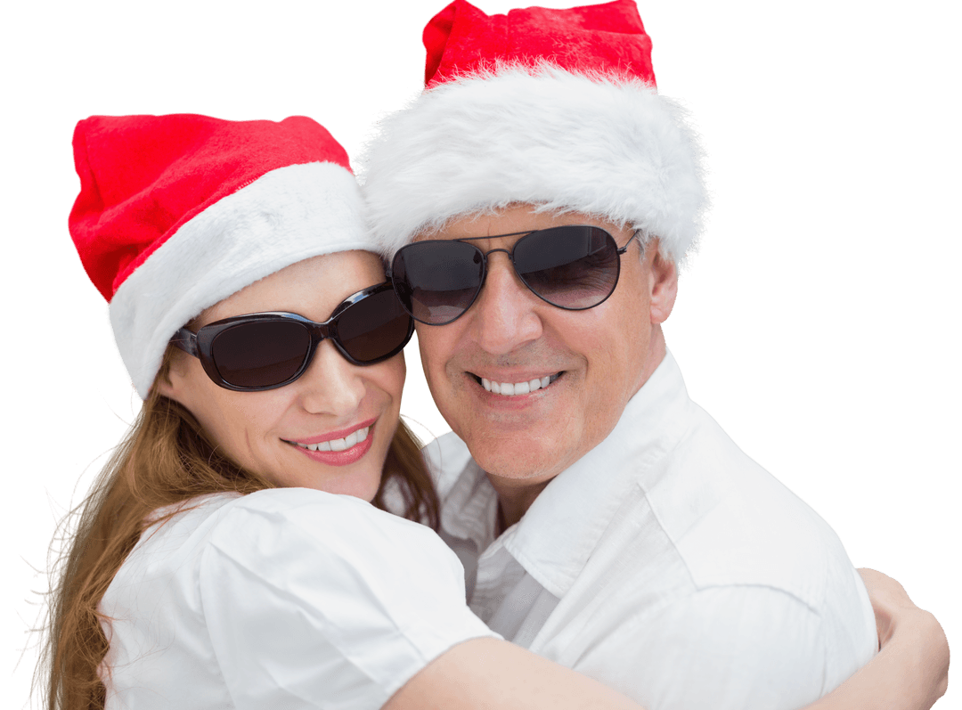 Smiling Couple in Santa Hats Embracing Isolated on Clear Background